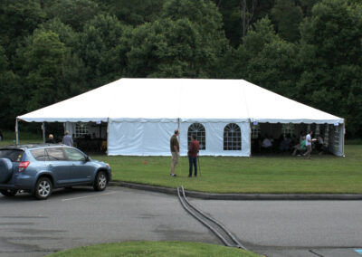 A large white tent is being used as an event structure.