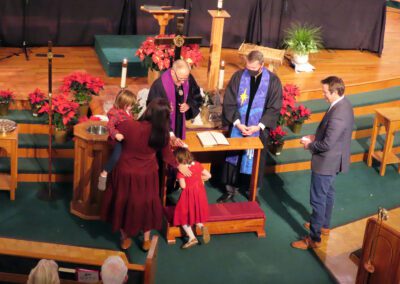 A group of people standing around a church.