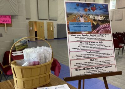 Church relaunch display with basket and schedule